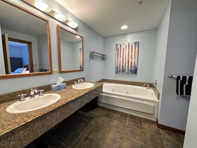 bathroom featuring tile patterned flooring, a washtub, and vanity