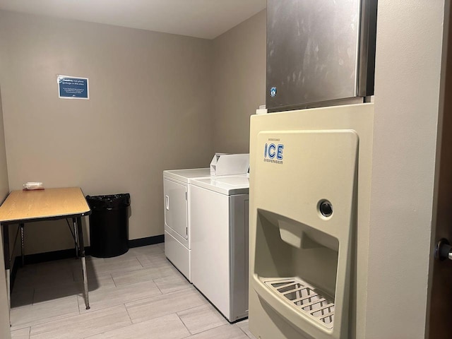 clothes washing area featuring independent washer and dryer