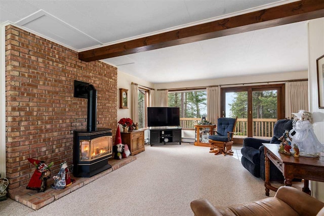 carpeted living room featuring a wood stove and beamed ceiling