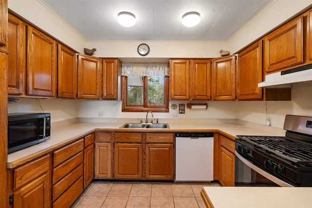 kitchen with stainless steel gas range oven, ornamental molding, white dishwasher, sink, and light tile patterned flooring