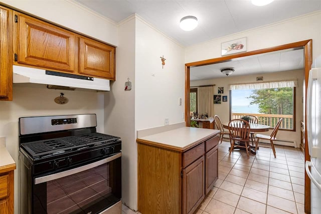 kitchen with crown molding, light tile patterned floors, and stainless steel gas range