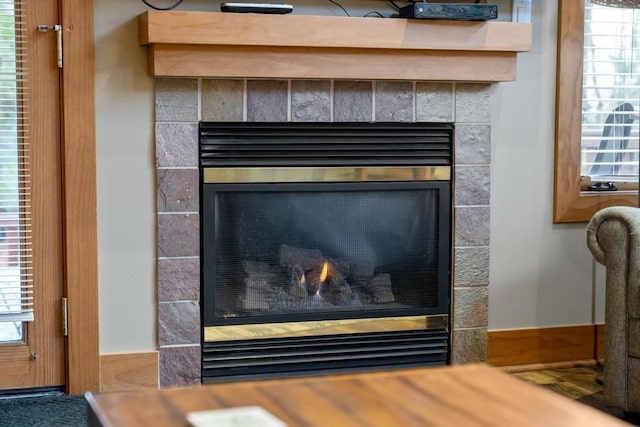 interior details with a tiled fireplace