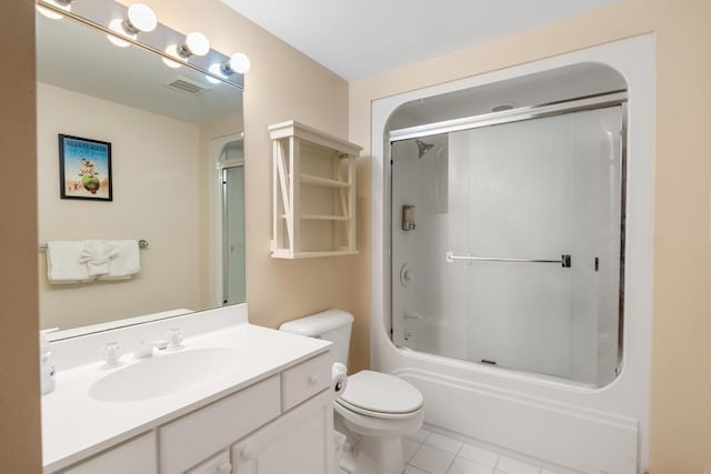 full bathroom featuring tile patterned floors, vanity, enclosed tub / shower combo, and toilet