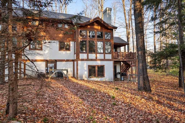 rear view of house with a deck