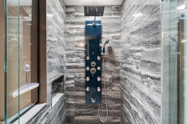 bathroom with a tile shower