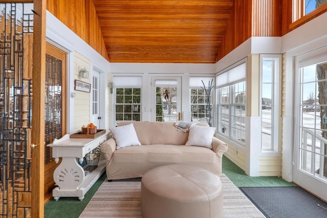 sunroom with lofted ceiling and wood ceiling