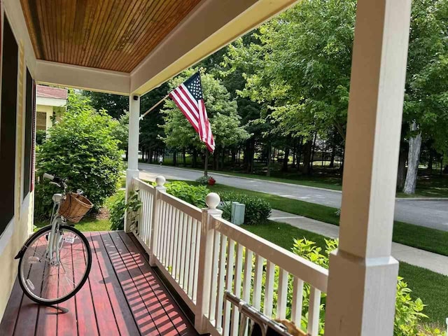 wooden terrace featuring covered porch