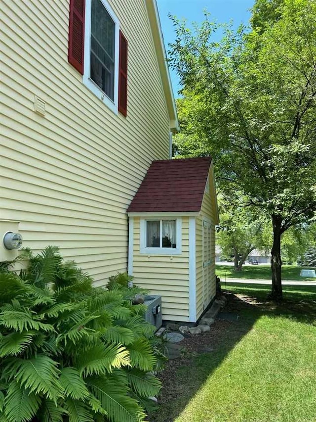 view of side of property with a yard