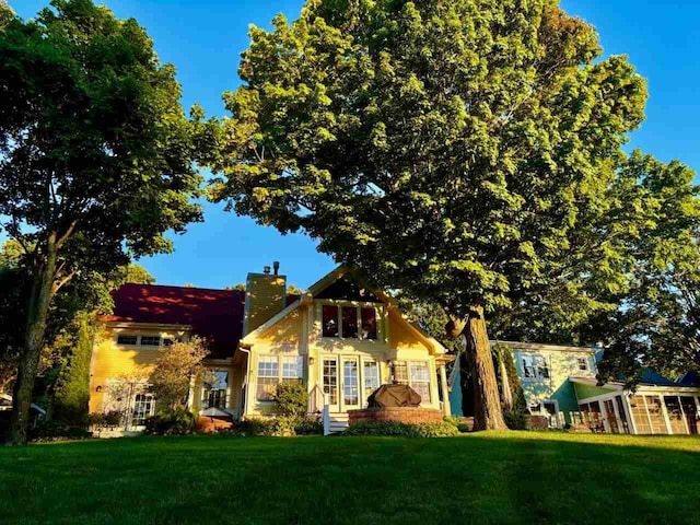 view of front of home with french doors and a front yard