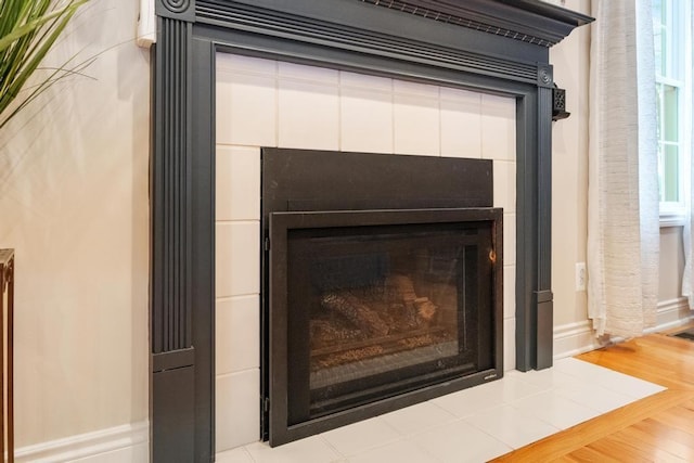 room details featuring wood-type flooring and a fireplace