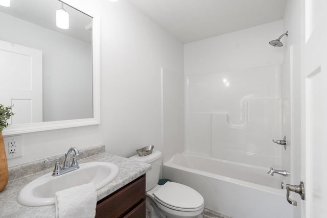 full bathroom with vanity,  shower combination, and toilet