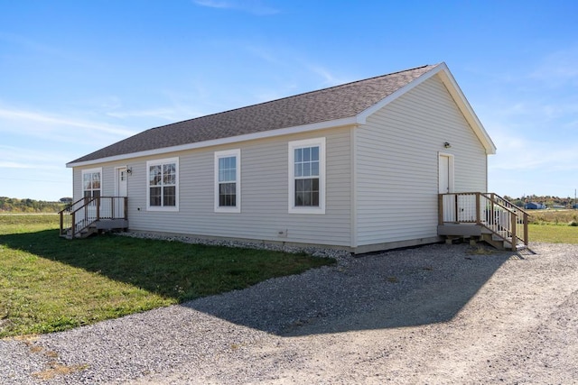 view of side of property featuring a yard