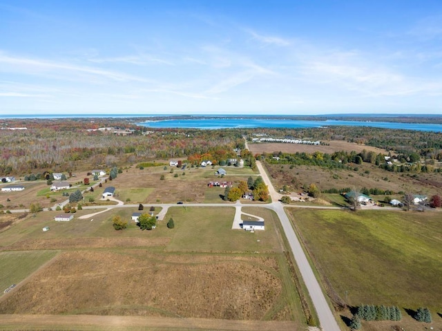 drone / aerial view with a rural view and a water view