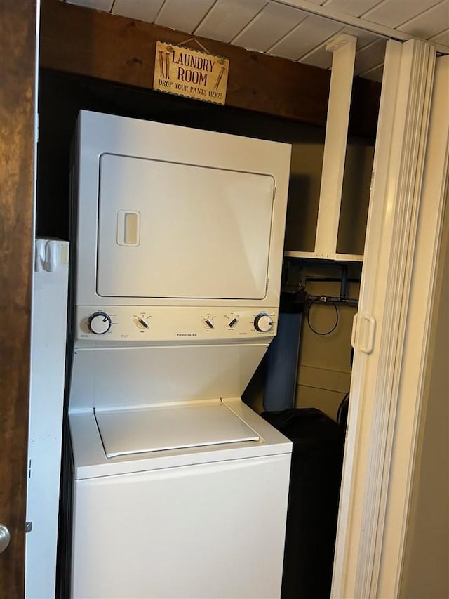 laundry room with stacked washer and dryer