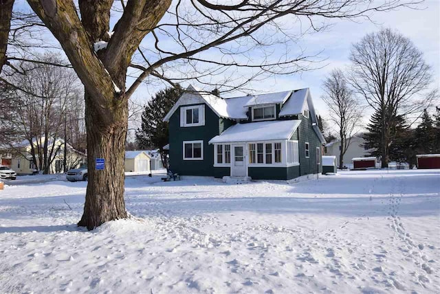 view of snow covered house