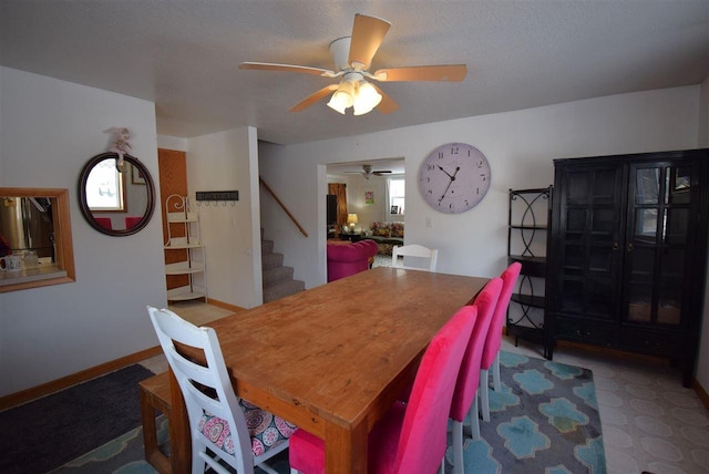 dining space with ceiling fan