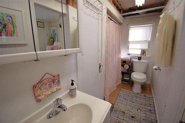 bathroom with sink and toilet