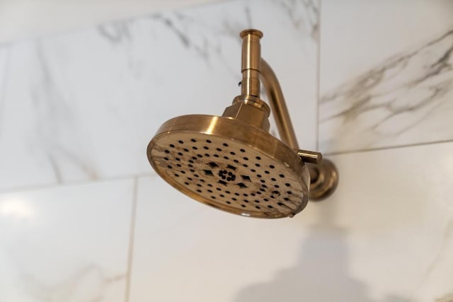 interior details featuring a shower