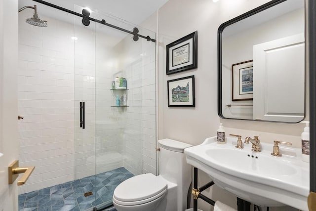 bathroom featuring sink, toilet, and walk in shower