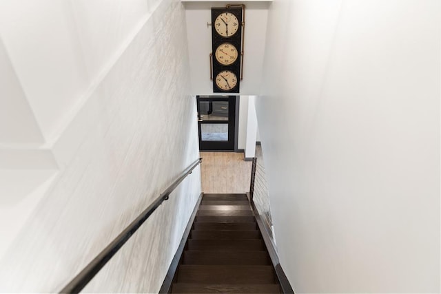 stairway with wood-type flooring