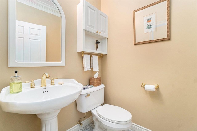 bathroom with toilet and sink