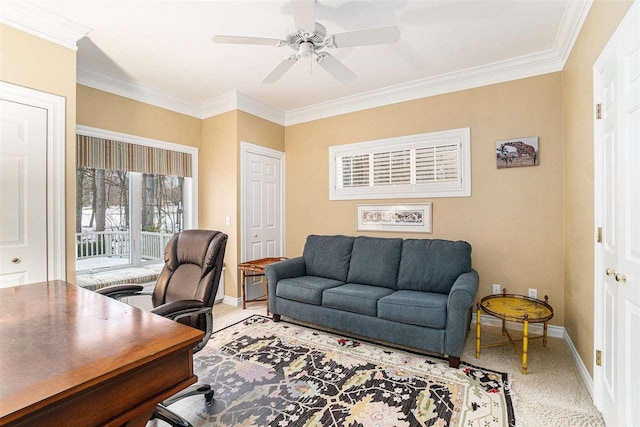 carpeted office space with crown molding and ceiling fan