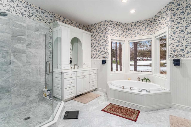 bathroom featuring vanity and shower with separate bathtub