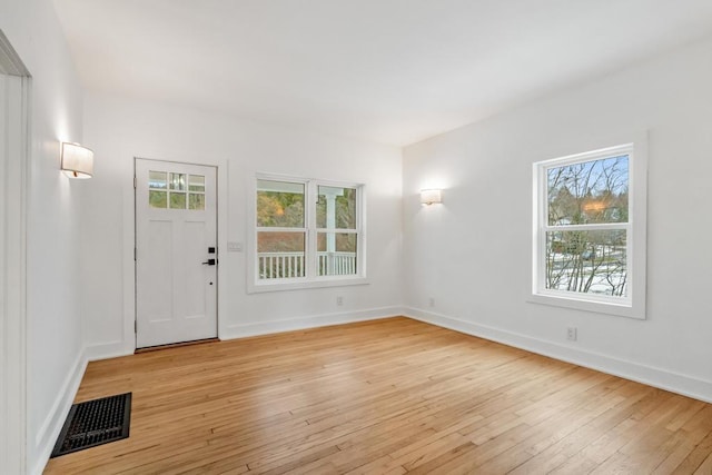 entryway with light hardwood / wood-style floors