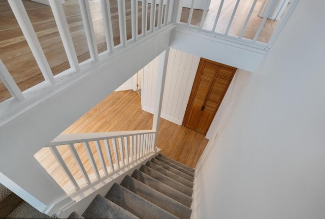 stairway featuring wood-type flooring