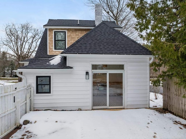 view of snow covered house