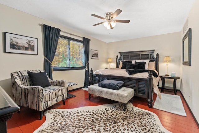 bedroom featuring dark hardwood / wood-style floors and ceiling fan