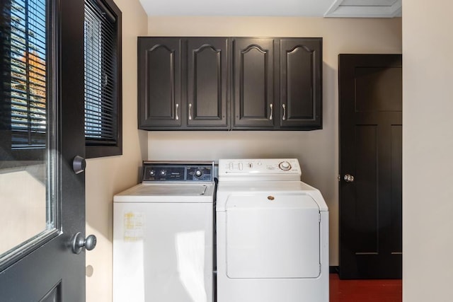 laundry room with cabinets, separate washer and dryer, and dark wood-type flooring