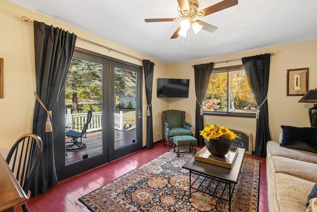 living room with hardwood / wood-style floors, ceiling fan, and a healthy amount of sunlight