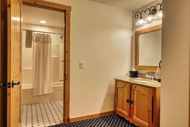 bathroom with vanity and shower / tub combo with curtain