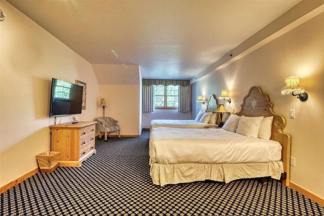 carpeted bedroom featuring lofted ceiling