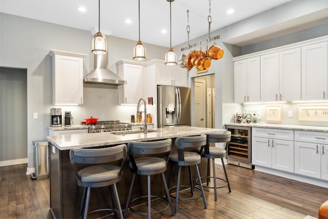 kitchen featuring pendant lighting, white cabinetry, stainless steel fridge with ice dispenser, and wine cooler