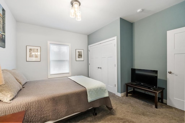 carpeted bedroom featuring a closet