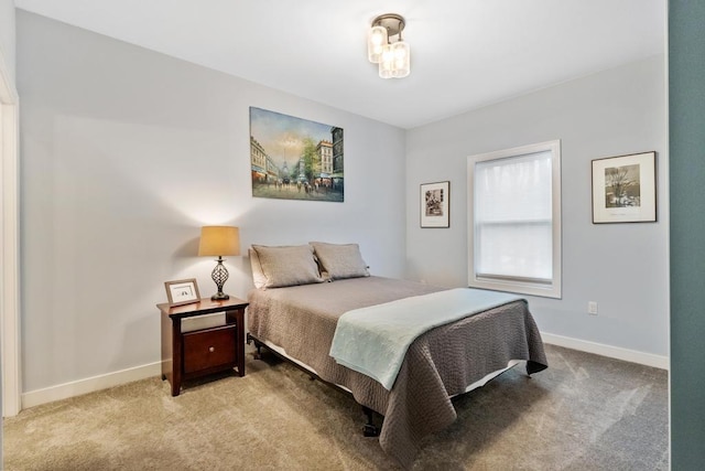 bedroom featuring light carpet