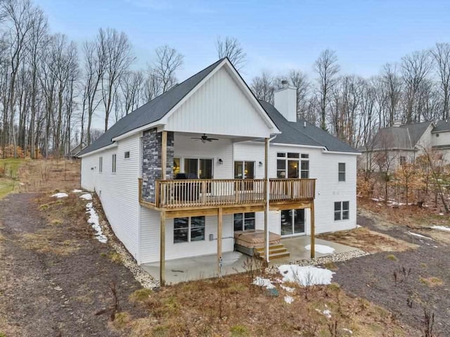 back of property with a patio area, ceiling fan, and a deck