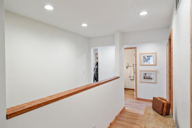 hall with light hardwood / wood-style flooring