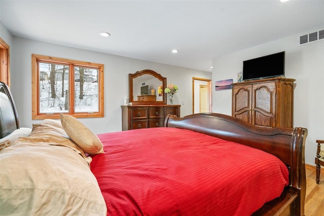 bedroom with light wood-type flooring