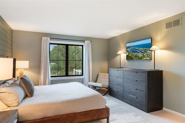 bedroom featuring light carpet