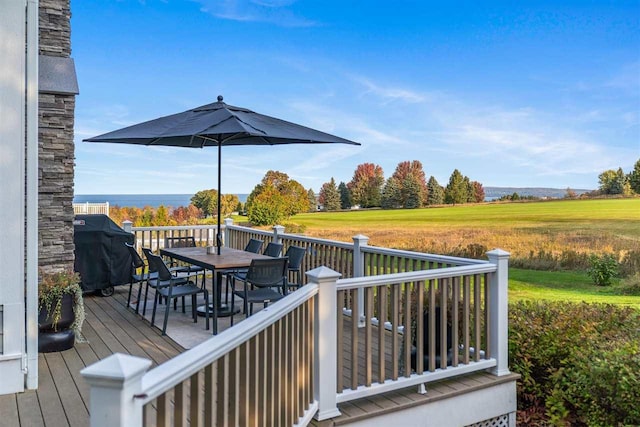 wooden terrace featuring a grill