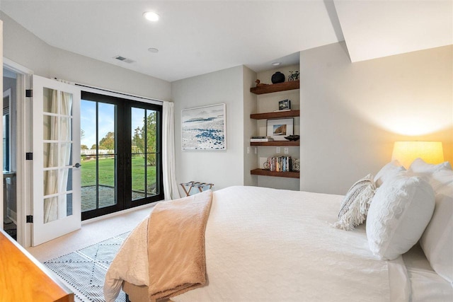 bedroom with access to exterior and french doors