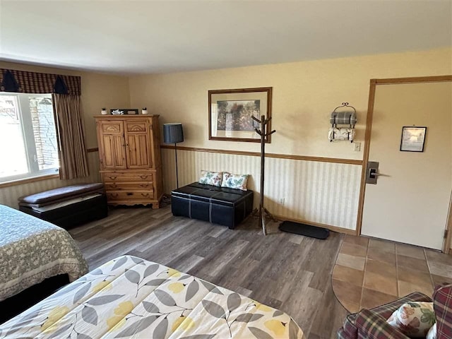 bedroom with dark wood-type flooring