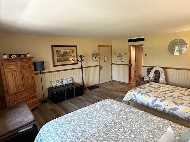 bedroom featuring dark hardwood / wood-style flooring