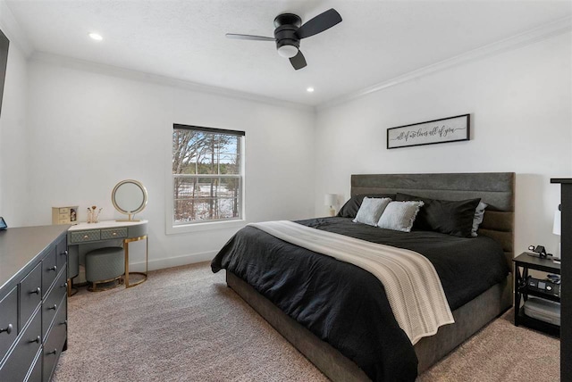 carpeted bedroom with ceiling fan and crown molding