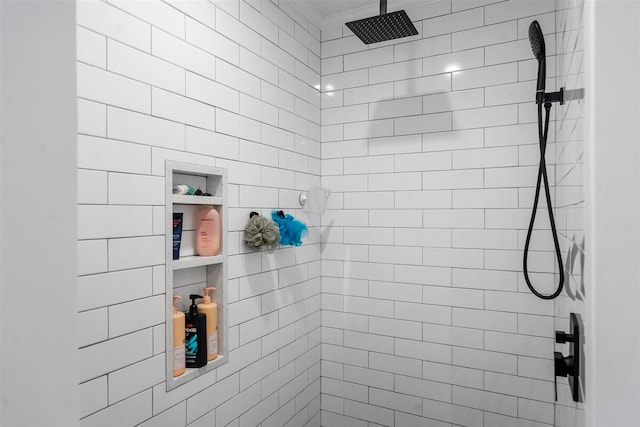 bathroom with a tile shower