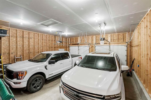 garage with washer and clothes dryer