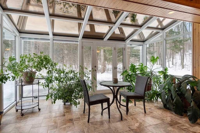 sunroom featuring french doors and a wealth of natural light